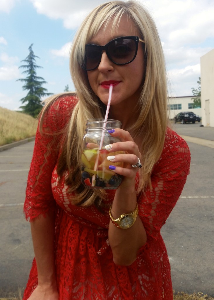 Sipping water in my red dress...